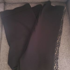 NYJD Black stretch pants with lace on the side of the leg.